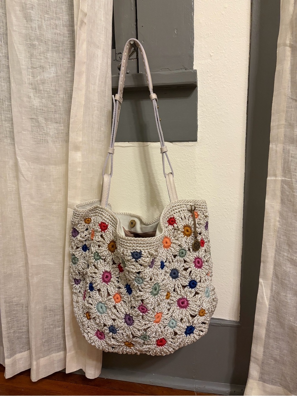 The Sak Cream Crochet Shoulder Bag with Multicolor Floral Embroidery